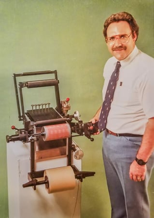 Duane Dunsirn with machinery he invented c. 1970s